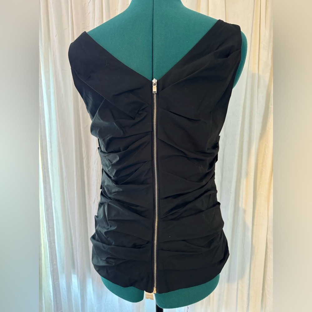 Ann Taylor. 
Fitted black sleeveless top.